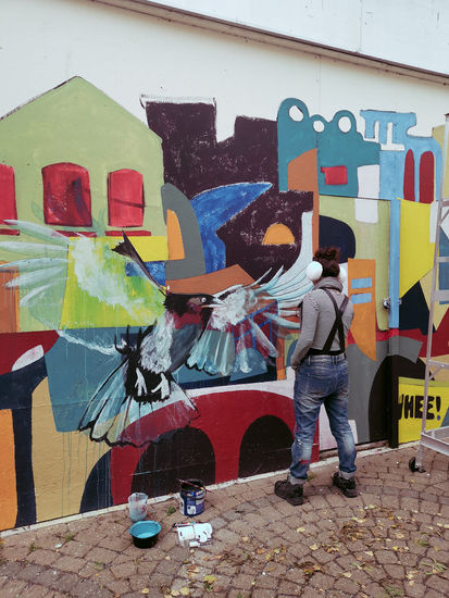 Semi-abstract mural of ravens and buildings