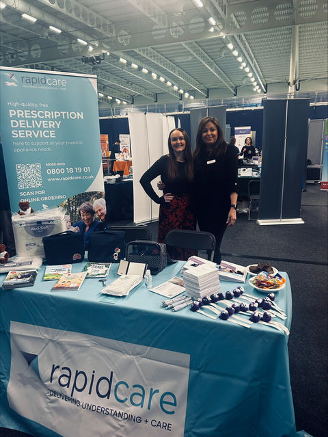 Vanessa and Carli at the Rapidcare stand during the 2025 Bowel Conference in Bolton.