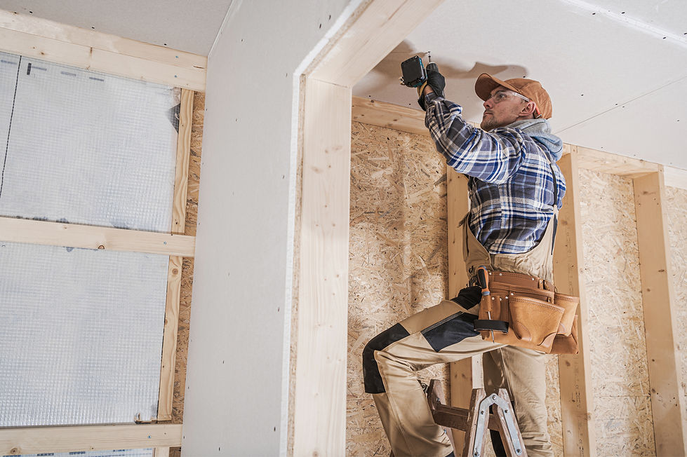 image of a man installing drywall