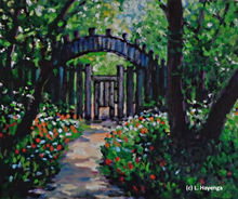 A pathway that winds through big trees and flower beds ends at a closed gate.