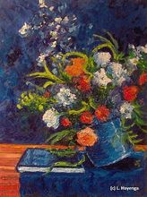 A vase full of brightly textured flowers tilts to one side and appears to be falling off the table it sits on.
