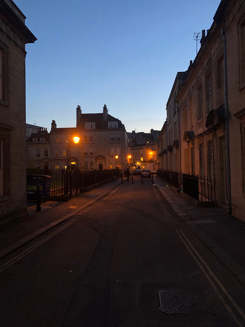 Night photo of a street in Bath.