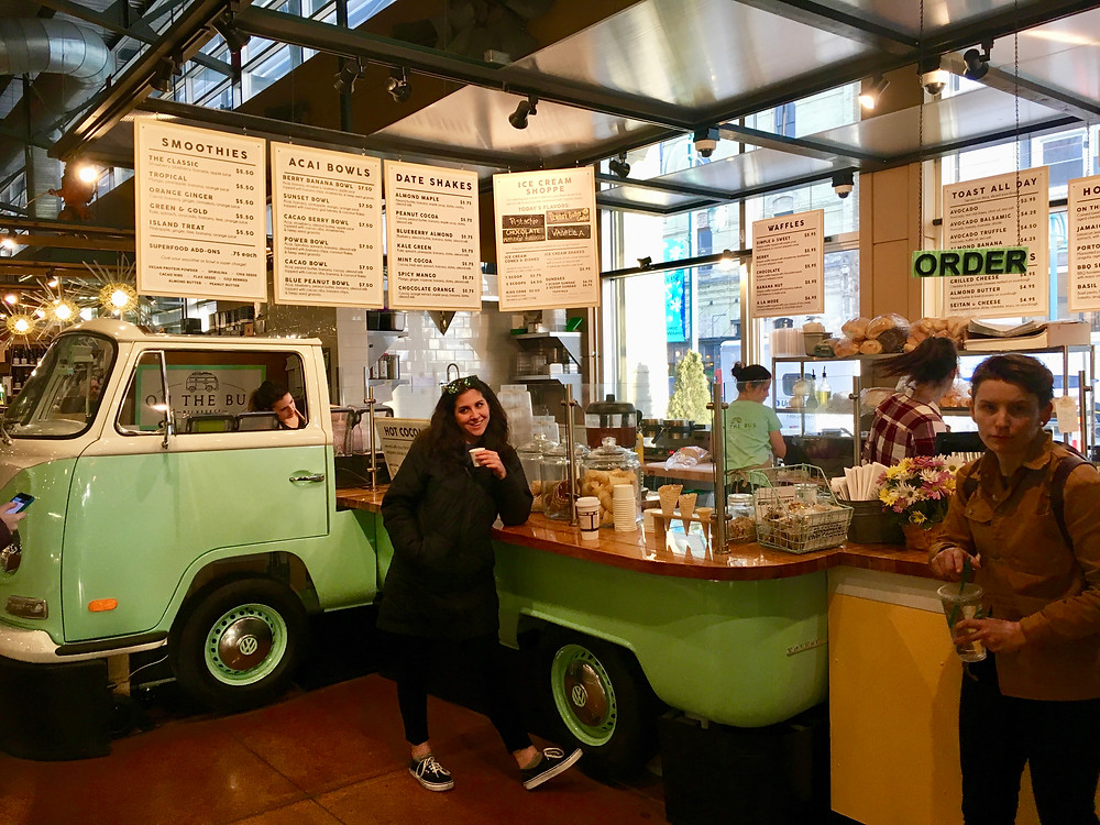 My sister ordering juice inside Milwaukee Public Market