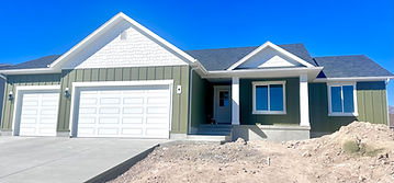 THE PAIGE PLAN A CRAFTSMAN STYLE RAMBLER WITH 3RD CAR GARAGE AND INVITING FRONT PORCH