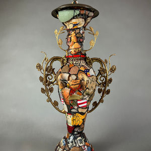 Ancient Futurism reimagines the classical amphora as a vessel for our fractured times. Built from stacked, repurposed domestic objects and covered in shards, paint, and collage, each form is a mosaic of histories and cultures. Guided by the Shattered Vase Theory, the work reflects cycles of destruction and reconstruction—personal and national—as democratic ideals crack under authoritarian strain. These imagined relics hold the memory of patriotism, the evidence of collapse, and the fragile possibility of renewal.