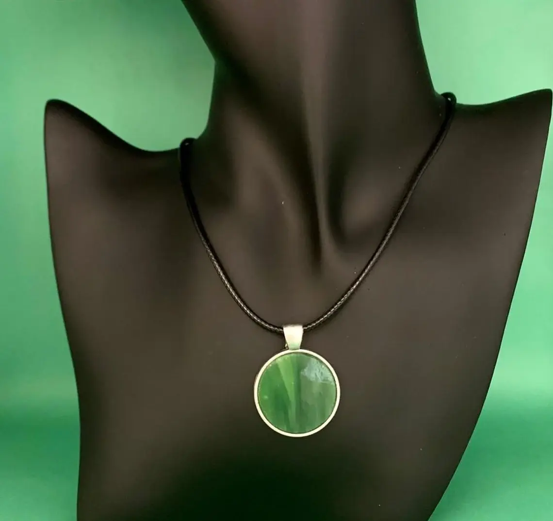 Hand-cut green stained glass pendant