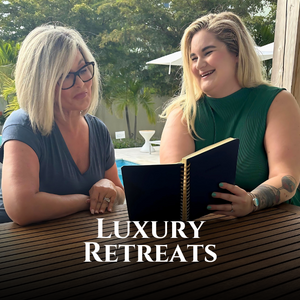 two women at a table looking at a notebook, luxury retreats