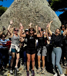 Retreat joy jumping up on rock.jpg