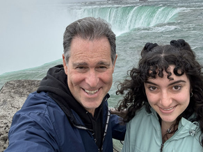 Doug and Cerena standing at Niagara Falls, highlighting this month’s environmental conservation theme.