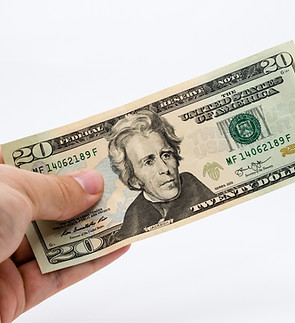 closeup-shot-person-holding-dollar-bill.jpg