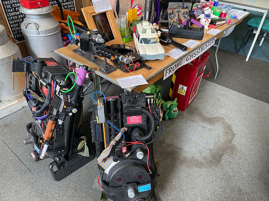 A table display decorated with Ghostbuster props