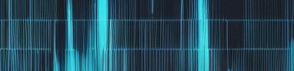 a dark background with a faint blue glow of signals on a spectrum analyser.jpg