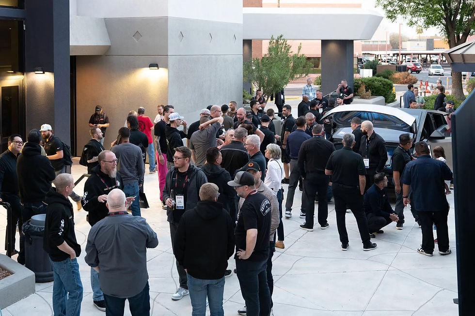 Large group of people gathered outside building for an event