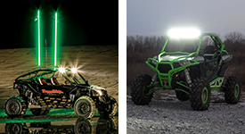 Off-road UTVs with custom green whip lights and LED bars.
