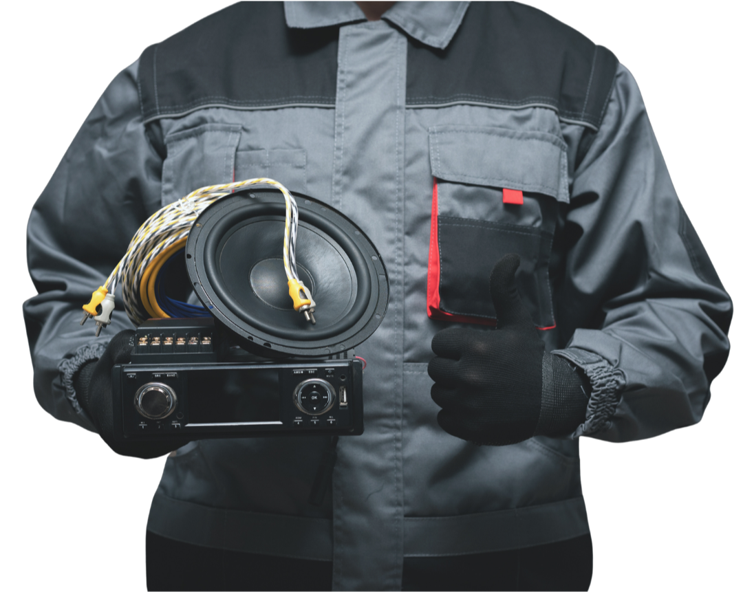 Technician holding equipment for car audio installation.