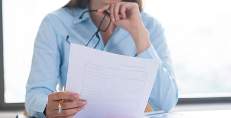 closeup-woman-holding-reading-document.jpg
