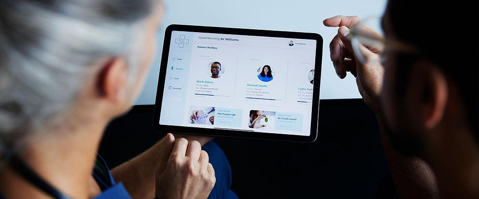 Healthcare professionals using digital technology to support clinical decision-making and quality oversight.
