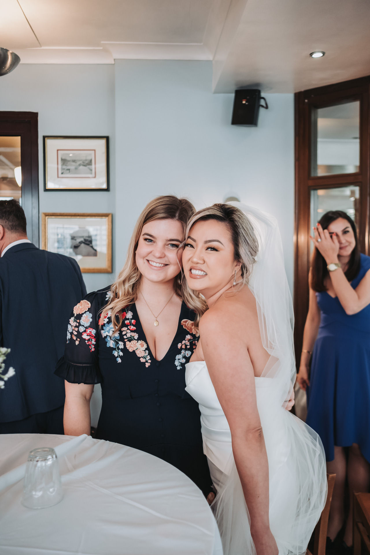 bride and guest posing 
