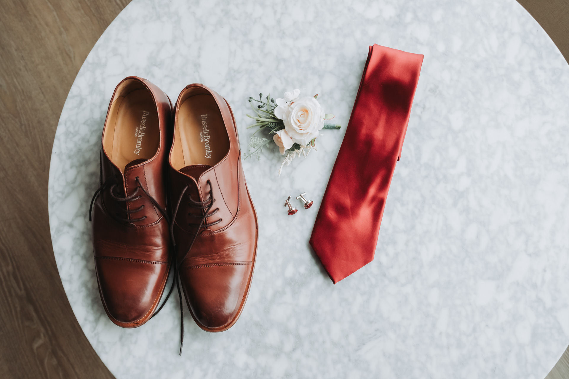 wedding shoes and tie and flowers