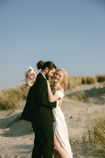 Romantic elopement at the sea in the dunes
