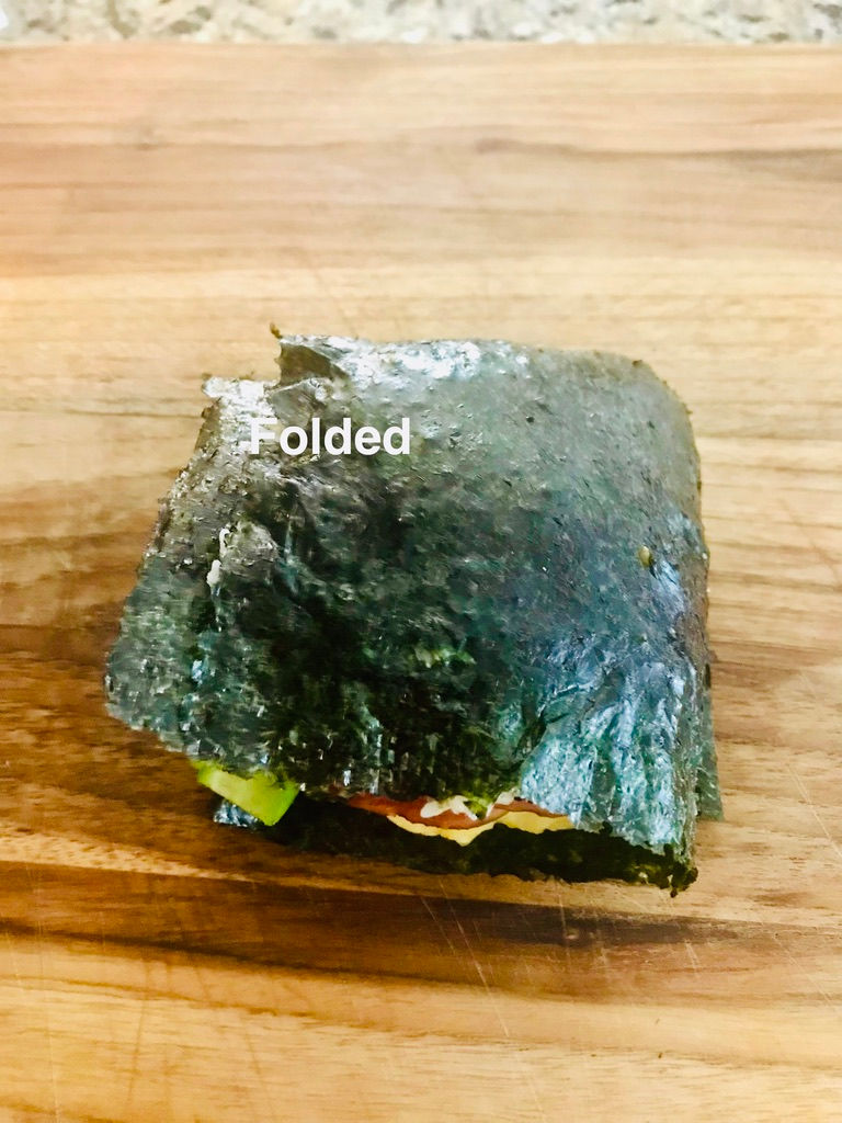 Now we have completed the folding steps of making our onigiruz sushi