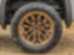 Gold bronze rimmed wheel and tire