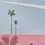 Miniatura: Minimalist painting of a bicycle with flowers, palm trees, and a pink wall by Felix Burgos.