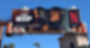 Static billboard with cutout of money attached to the top and sides.