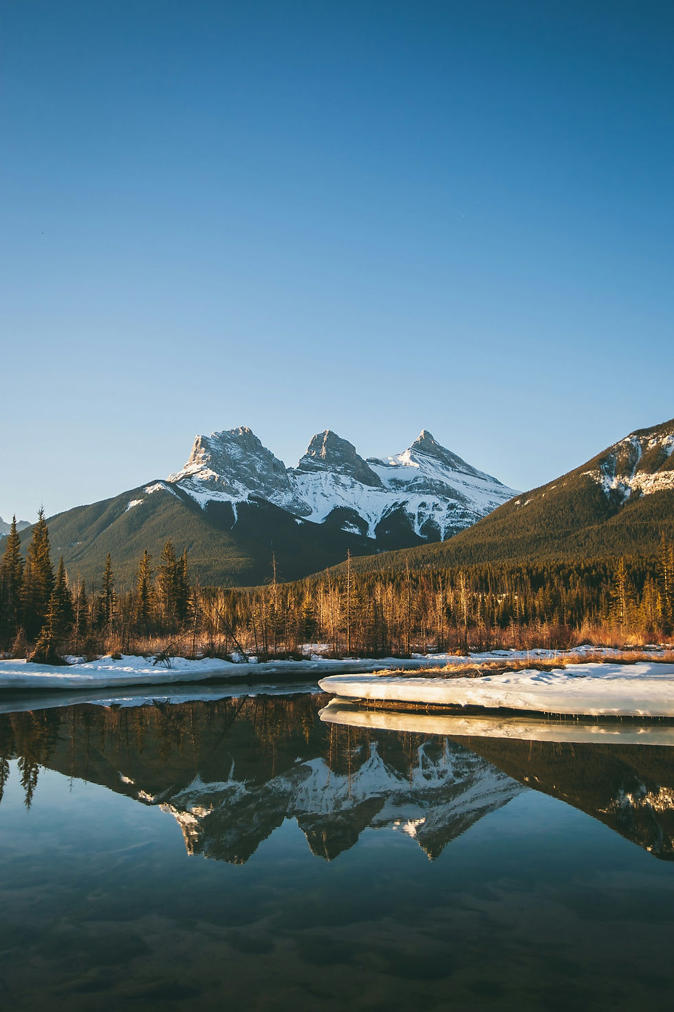 Three Sisters viewpoint with water reflecting the peaks