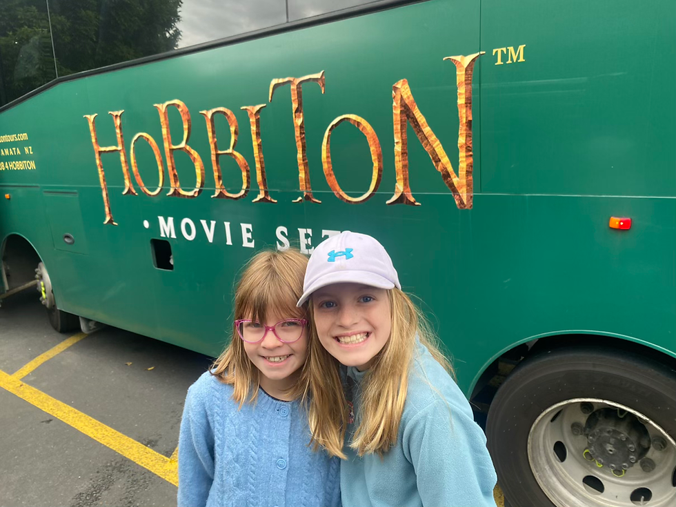 The girls in front of the Hobbiton coach