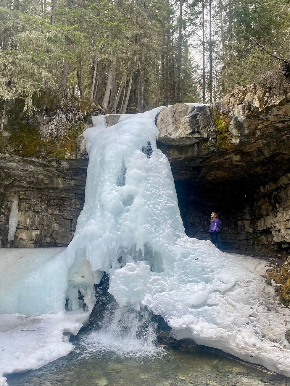 Jess behind the marmot falls