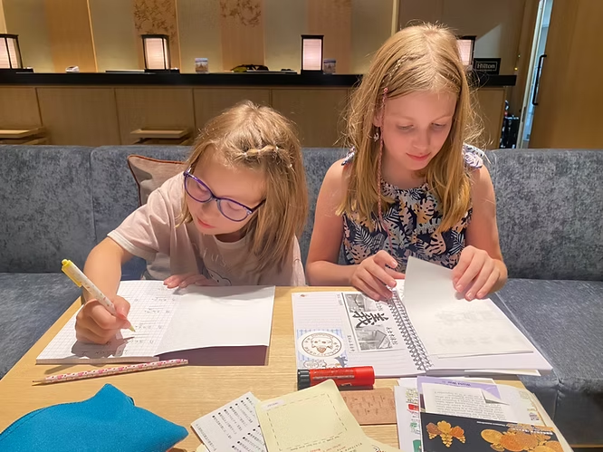 The girls doing some homeschooling