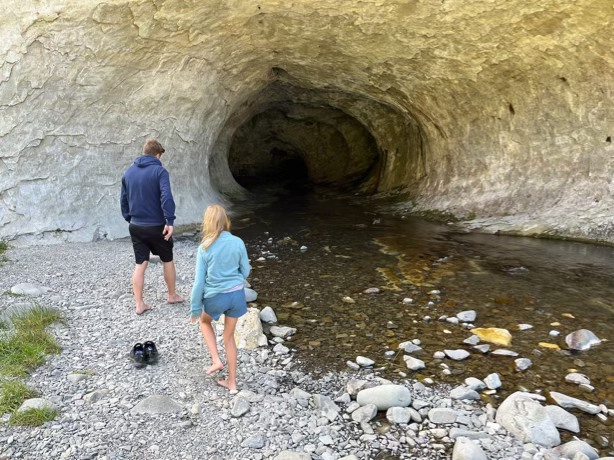 In front of the cave
