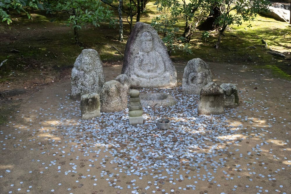 throwing coins at a temple statue