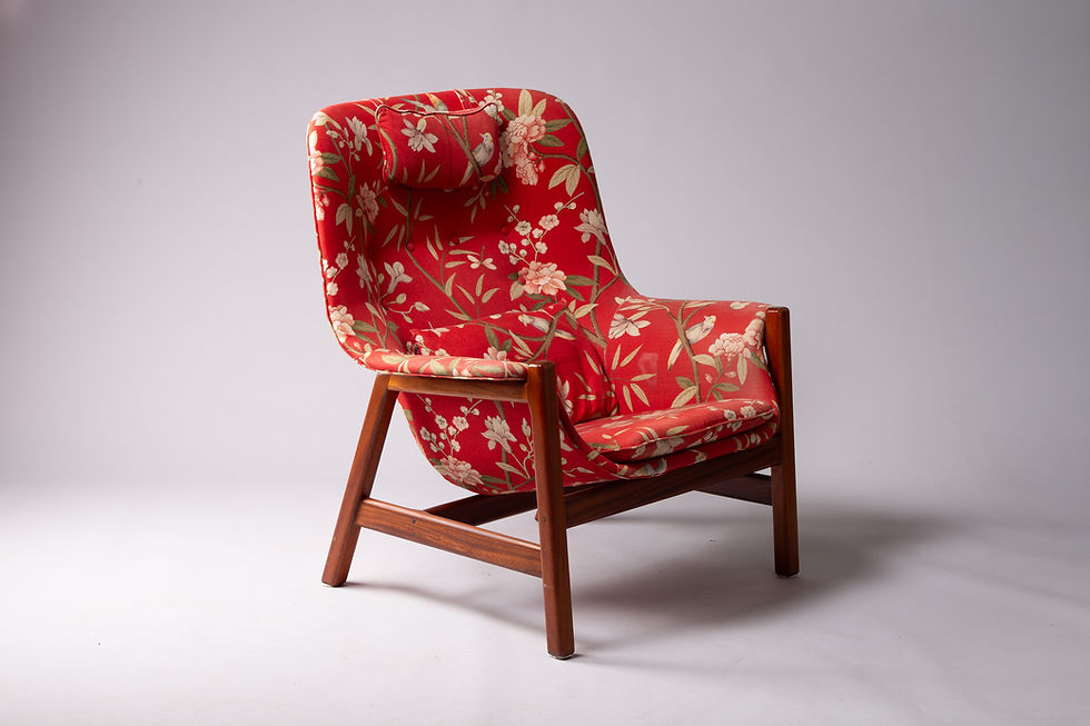 Thumbnail: Caravelle lounge chair by Carl-Gustaf Hiort af Ornäs, with a teak frame, red floral upholstery, seat cushion and headrest.