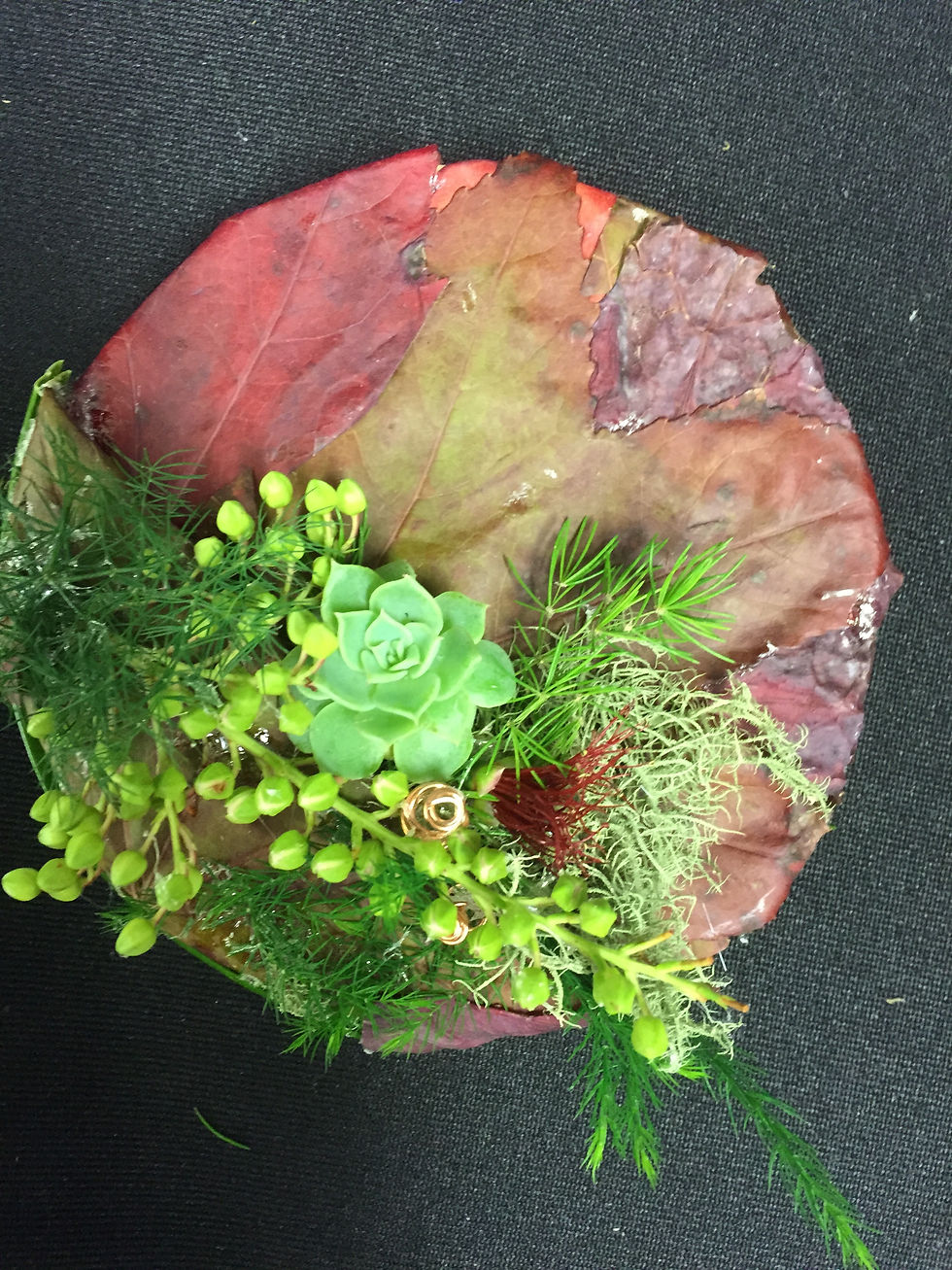 fresh flower design on maple leaf