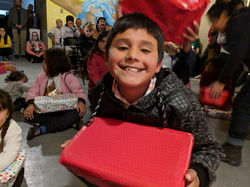 Student Brayan with Christmas gift