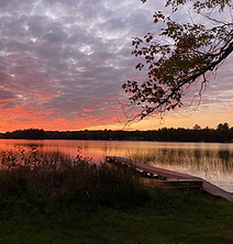 A sunset on the shores of lake thompson in rhinelander wisconsin
