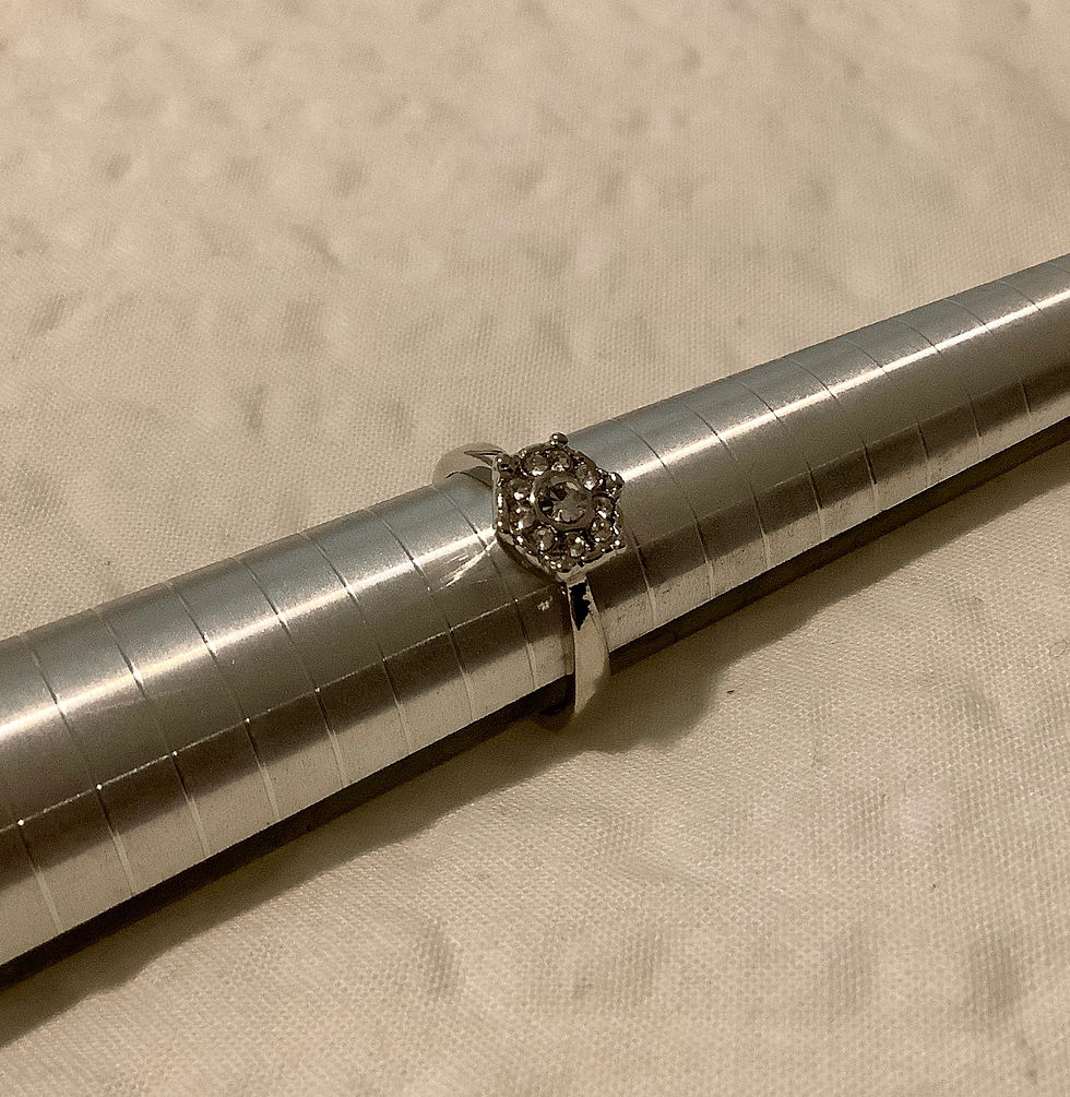 Thumbnail: Ring With Crystals Shaped Like A Flower