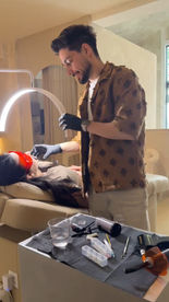 Professional applying tooth gems Rotterdam to a client.