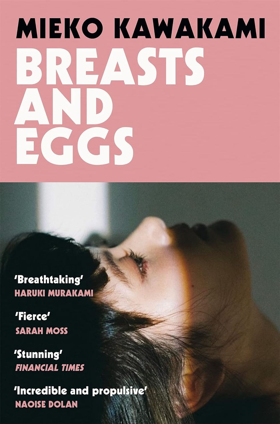 Book cover of Breasts and Eggs with japanese woman looking upwards