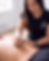 Acupuncturist performing treatment on a patient's back.
