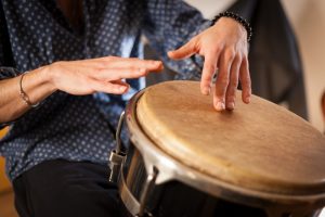 A drummer relies on flow to play well. If she becomes self-conscious, she looses the beat. Try it!