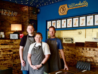 Yellowbelly Pizza Owners with Award