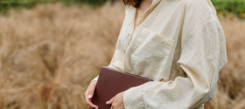 Close up of Hannah's torso area holding notebook