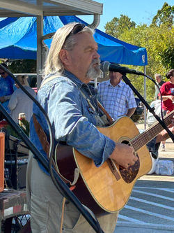 performing at Franklin, NC, 2024