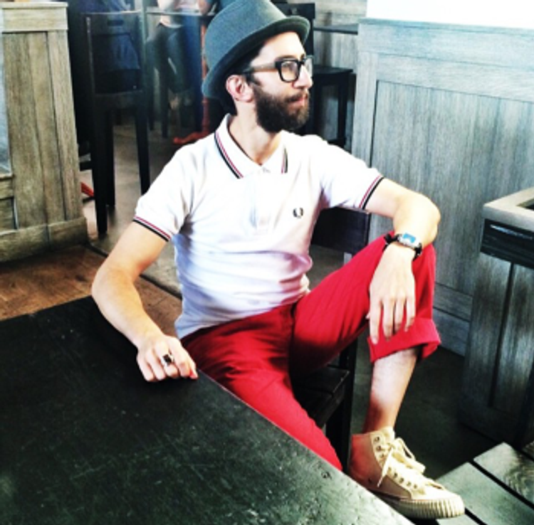 The white, blue and red accents will not make you look like Yankee Doodle. It will, however, lend your outfit a timeless, classic past-time look.