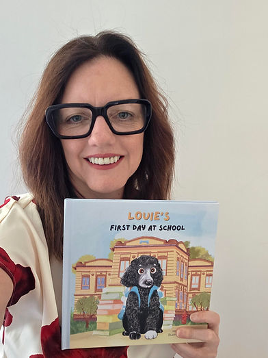 Photo with book red and white blouse.jpg