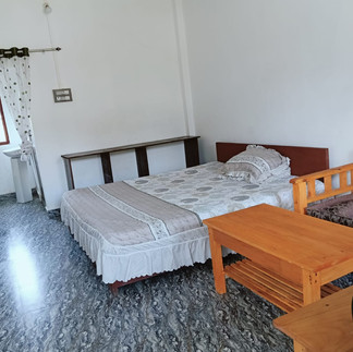 Comfortable double occupancy room at Kaji Lodge Anini starting from ₹2500, featuring clean bedding a