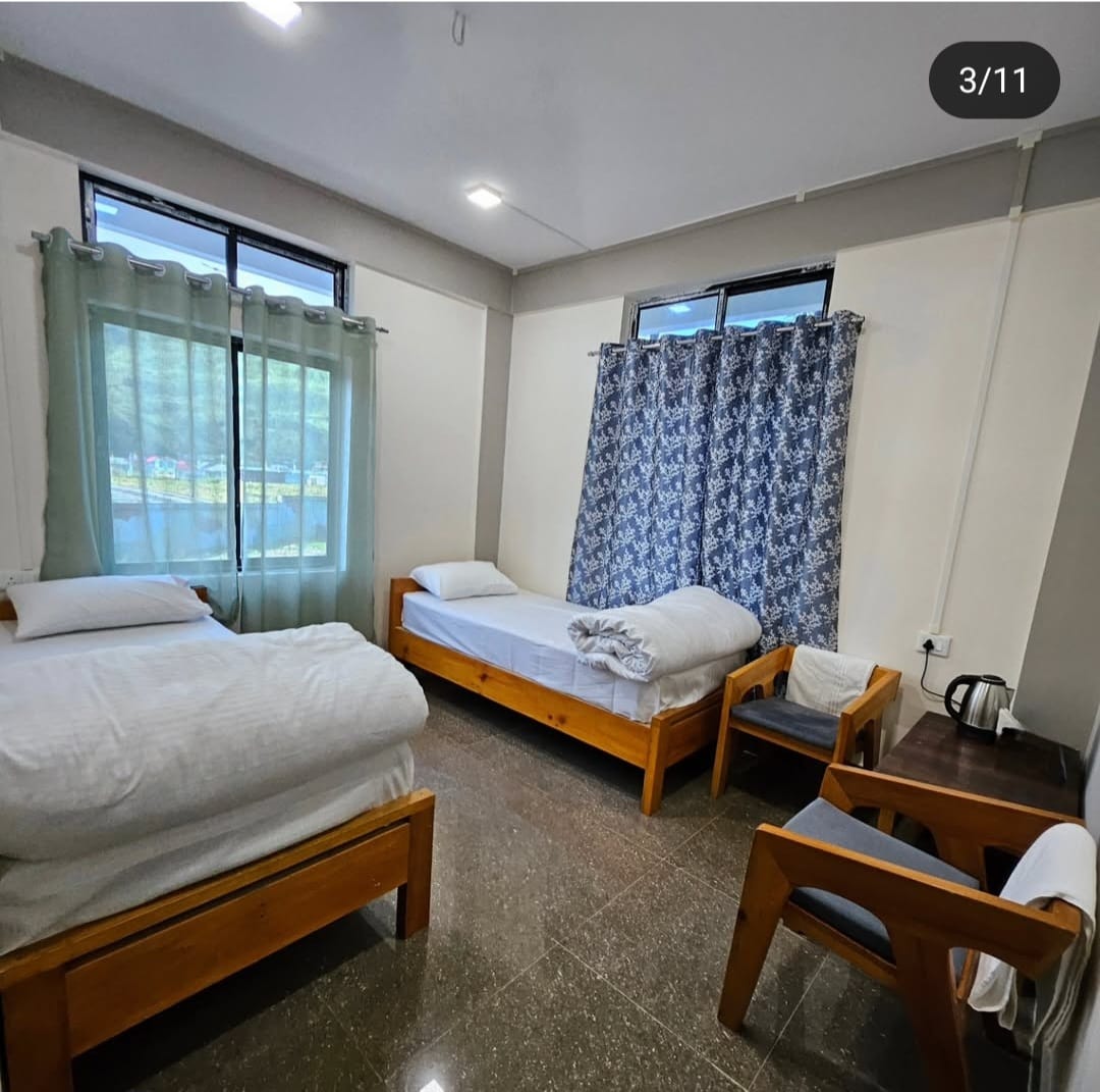 Cozy deluxe room at Khusimsim Mechuka homestay, ₹2000 double occupancy with valley views